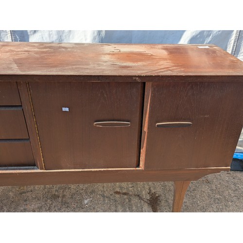 646 - A charming mid-century heavy teak side board with 3 drawers and 2 cupboard spaces