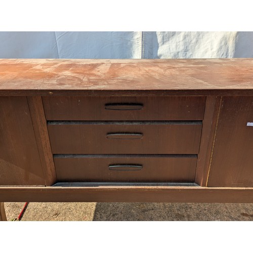 646 - A charming mid-century heavy teak side board with 3 drawers and 2 cupboard spaces