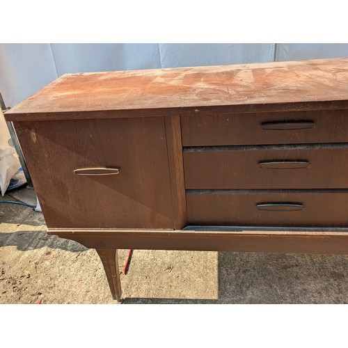 646 - A charming mid-century heavy teak side board with 3 drawers and 2 cupboard spaces