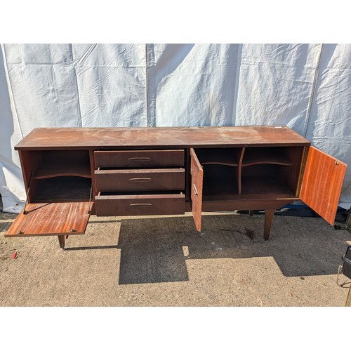 646 - A charming mid-century heavy teak side board with 3 drawers and 2 cupboard spaces