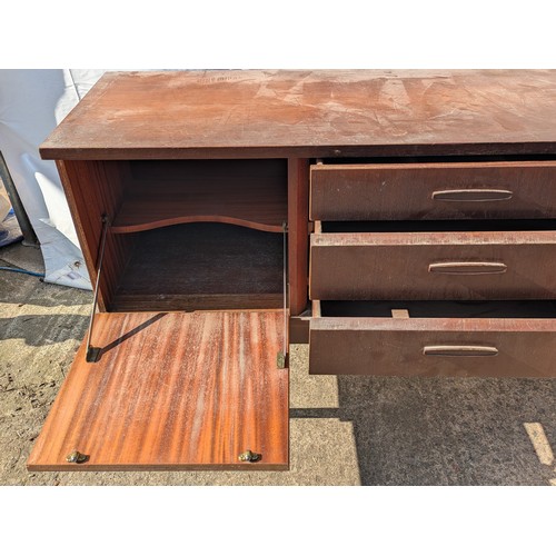 646 - A charming mid-century heavy teak side board with 3 drawers and 2 cupboard spaces