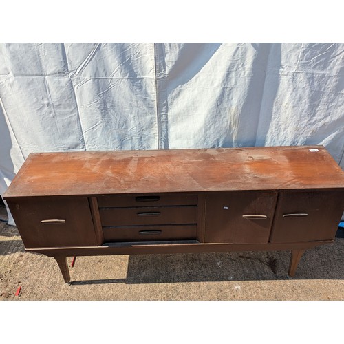 646 - A charming mid-century heavy teak side board with 3 drawers and 2 cupboard spaces