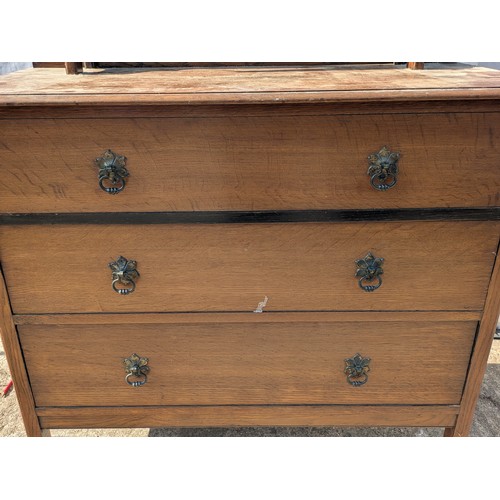 659 - A charming oak dressing table with Bevelled Mirror and 3 underlying drawers