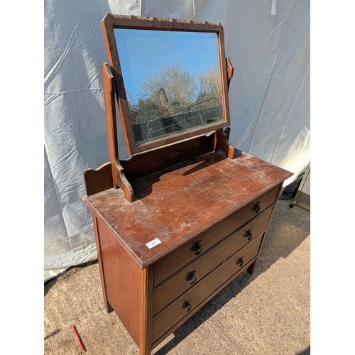 659 - A charming oak dressing table with Bevelled Mirror and 3 underlying drawers