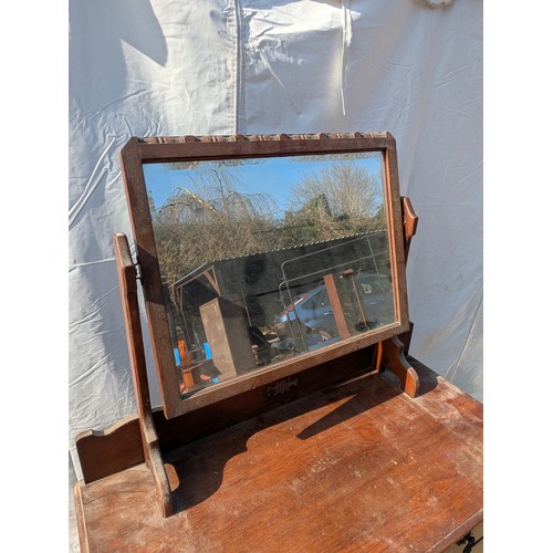 659 - A charming oak dressing table with Bevelled Mirror and 3 underlying drawers