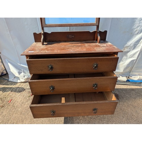 659 - A charming oak dressing table with Bevelled Mirror and 3 underlying drawers