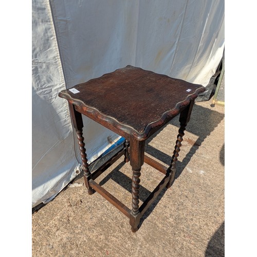 667 - An Oak side table with Bevelled top and barley twist legs