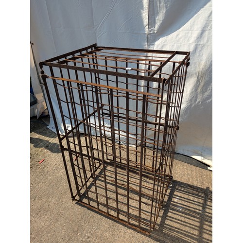 661 - An antique lockable double sided wine cellar storage rack