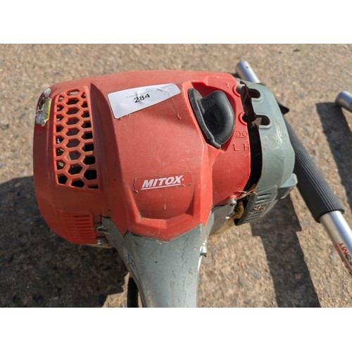 284 - A Mitox select 280 Mt petrol multi tool with various attachments