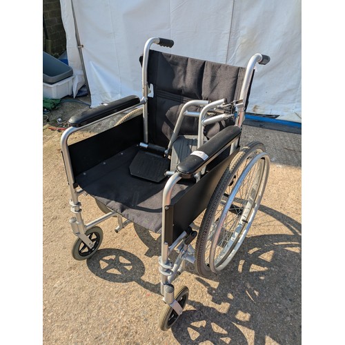 267 - A collapsible wheelchair with foot supports