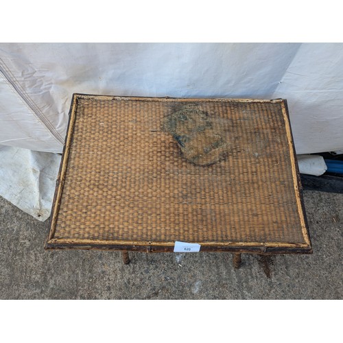 620 - An early 20th century wicker and bamboo table.