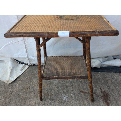 620 - An early 20th century wicker and bamboo table.