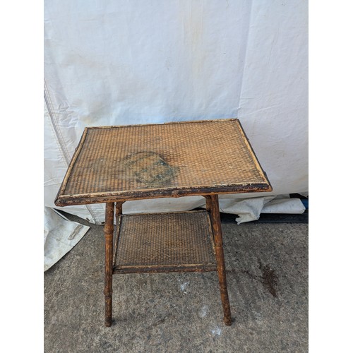 620 - An early 20th century wicker and bamboo table.