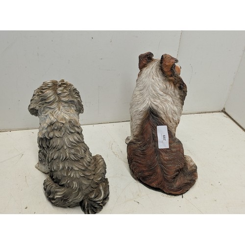 299 - A pair of resin dog statues