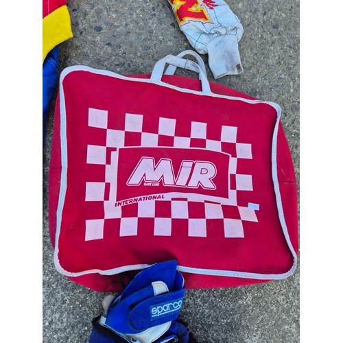 2101 - An MIR MW Mike Wilson racing suit and shoes in bag