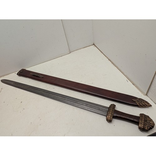 2116 - A Damascus steel sword in scabbard