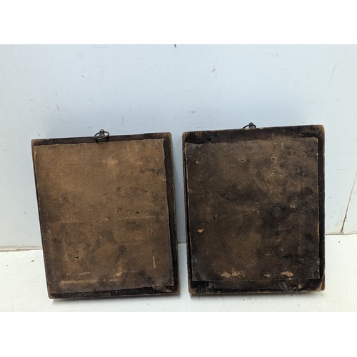 1093 - A pair of early 20th century silhouettes in walnut veneer frames