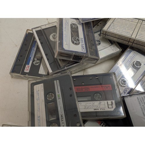 1513 - A large selection of cassettes for use with Zx spectrum and a selection of music cassettes