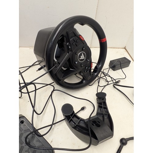 1511 - A thrustmaster T128 racing sim setup in original box (compatible with PC and Playstation)