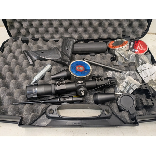 1097 - A crosman corp .22 caliber CO2 air pistol with scopes and accessories in hard case