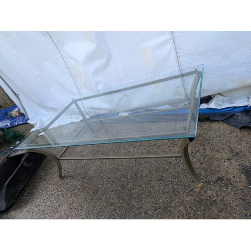 413 - A metal framed glass topped coffee table