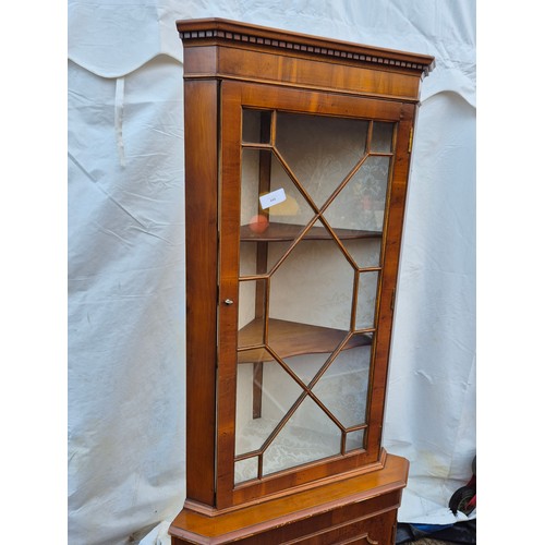 444 - A mahogany vernier corner display case with underlying drawer