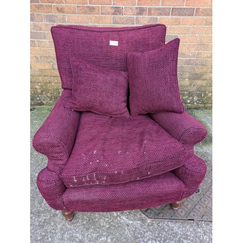 491 - A purple fabric upholstered armchair