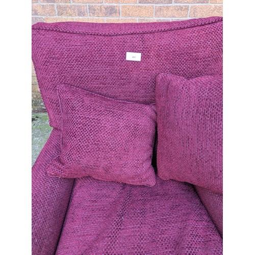 491 - A purple fabric upholstered armchair