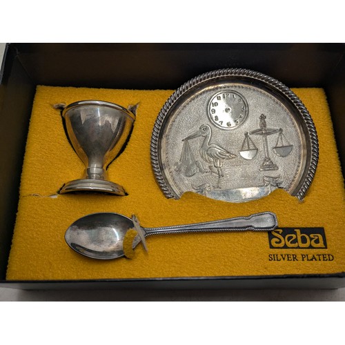 806 - A Seba silver plated egg cup, spoon and plate set in presentation box