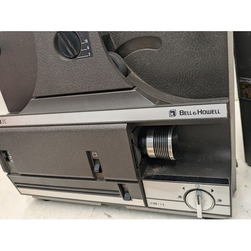 1320 - A bell Howell 1623 multi motion projector with manual