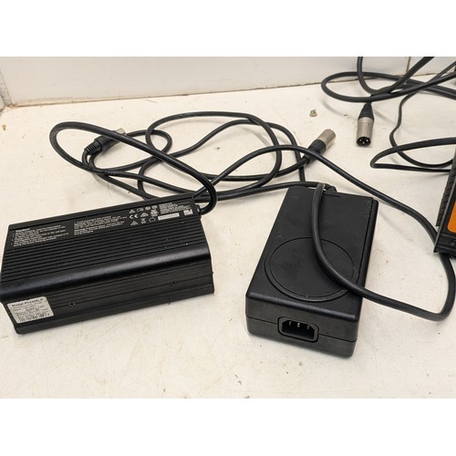 1321 - A selection of battery chargers and power supplies