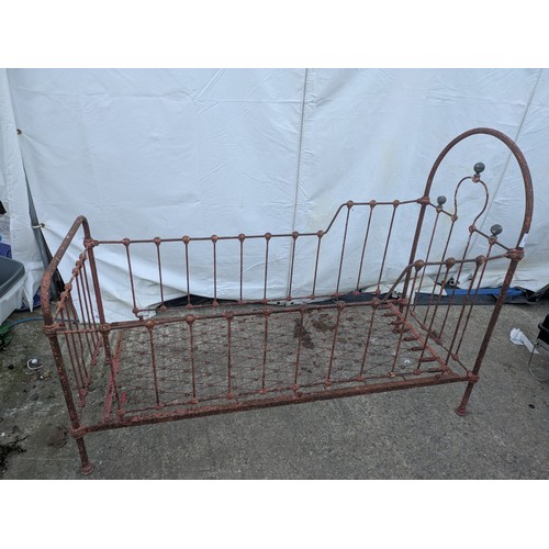 468 - A Victorian wrought iron collapsible cot bed