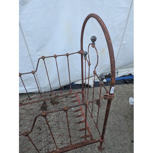 468 - A Victorian wrought iron collapsible cot bed