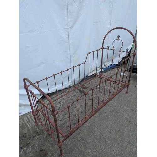 468 - A Victorian wrought iron collapsible cot bed