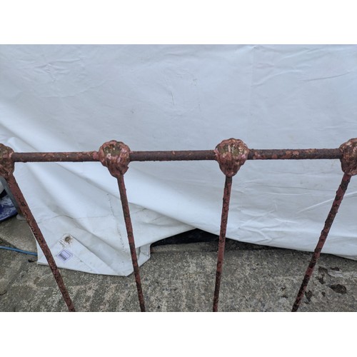 468 - A Victorian wrought iron collapsible cot bed