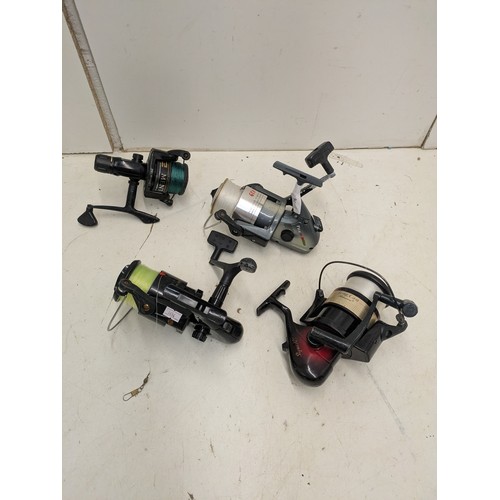 76 - A selection of 4 fishing reels