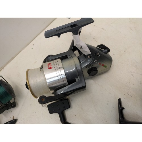 76 - A selection of 4 fishing reels