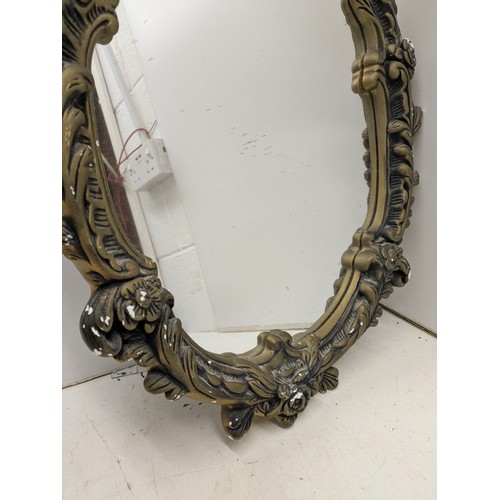 446 - A stylish ornate wall mounted mirror