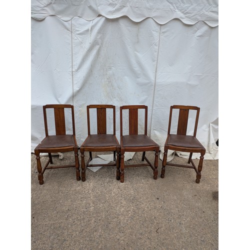 449 - A set of 4 oak dining chairs with leather seat bases