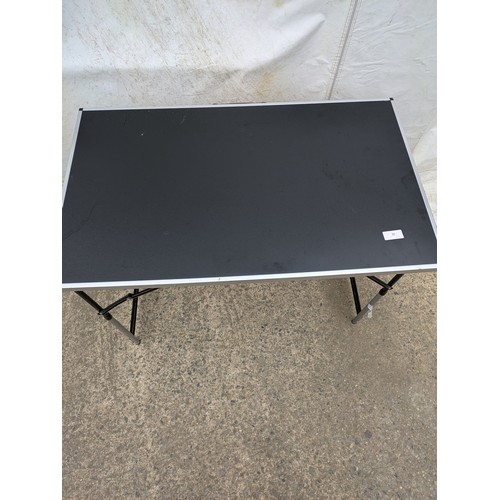 50 - A black collapsible table