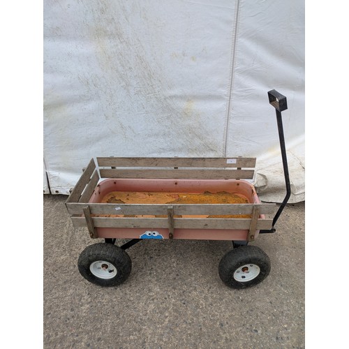 78 - A vintage wood sided pull along wagon