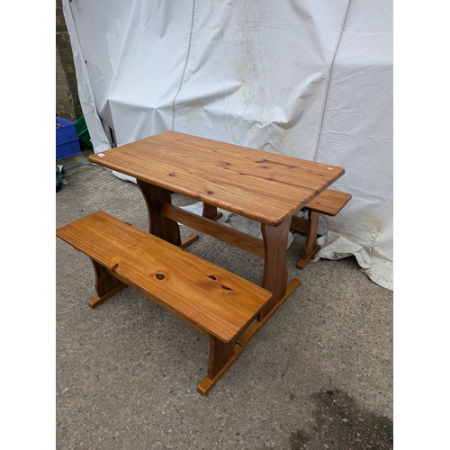 450 - A pine table with 2 bench seats