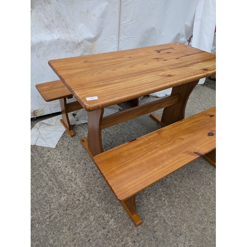 450 - A pine table with 2 bench seats