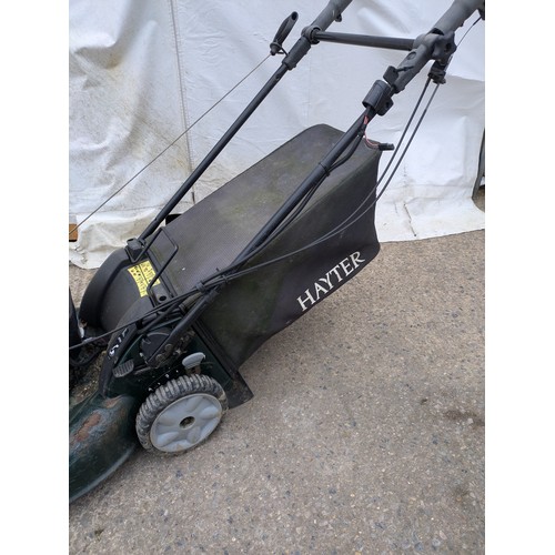 7 - A Rexling petrol lawn mower with a Briggs and Sttratton R53s engine