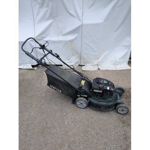 7 - A Rexling petrol lawn mower with a Briggs and Sttratton R53s engine