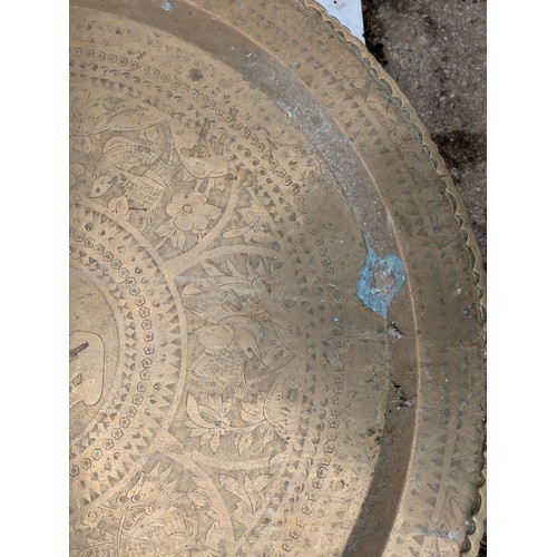 454 - An oriental brass tray table with stand