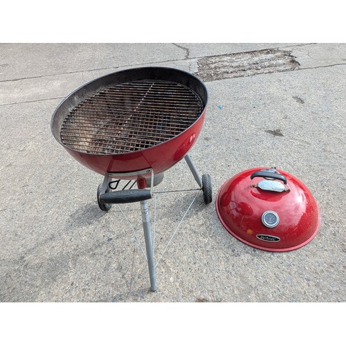 125 - A red outback barbecue smoker