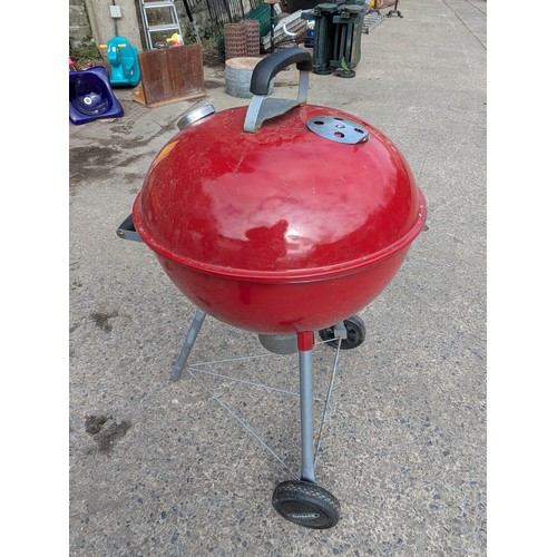 125 - A red outback barbecue smoker