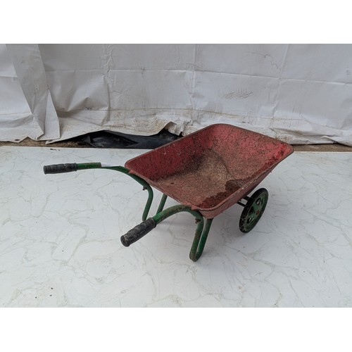 133 - A vintage metal children's wheelbarrow