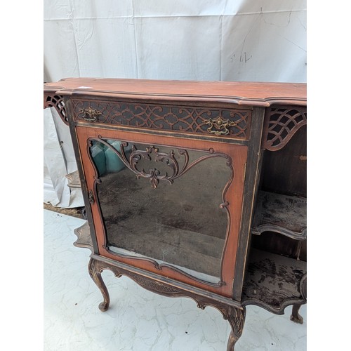 460 - A stylish Victorian mahogany display unit with glass Fronted shelving area and exterior Bevelled she... 